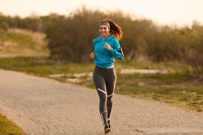 young-happy-sportswoman-running-road-morning-copy-space (1)